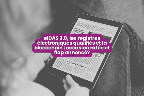 Personne consultant un document sur tablette illustrant le débat autour d’eIDAS 2.0 et des registres électroniques qualifiés comme la blockchain